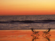 Silhouette of Two Chairs on the Beach